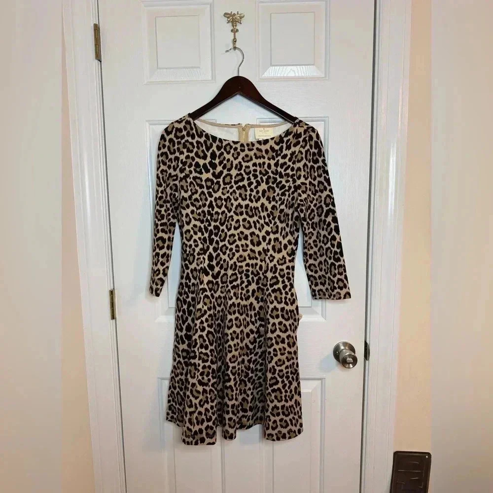Kate Spade leopard print dress  size 6 boat neck, fit & flare, zip back, pockets